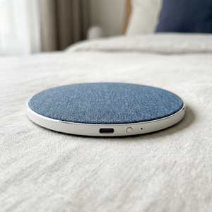 Close-up of the DriftDisc edge showing the USB-C port, button and LED