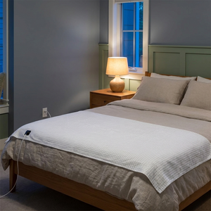 Evening bedroom with StillGrid across the bed